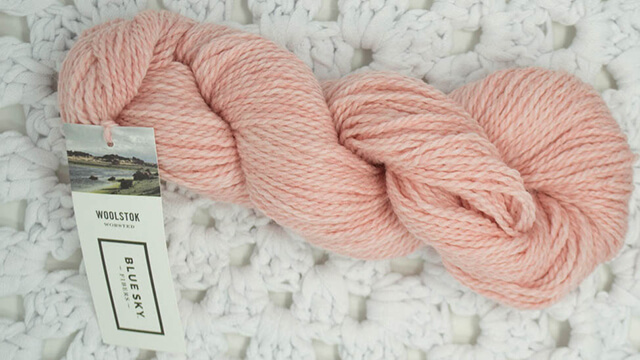 A photo of a skein of Blue Sky Fibers Woolstok Worsted in Quartz Crystal colorway.